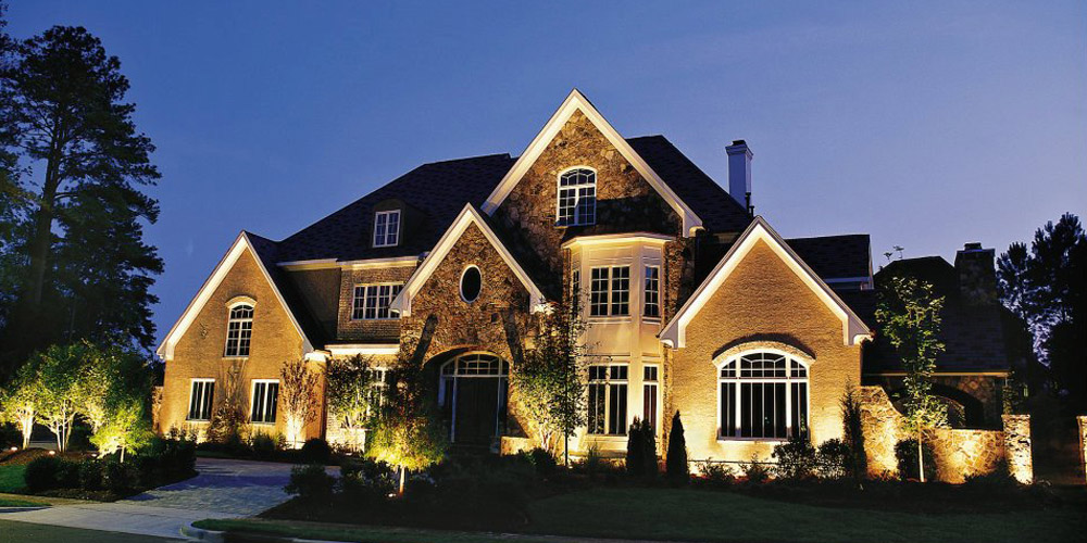 Front of large home with special lighting